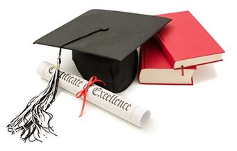 Graduation items including a cap with a tassle, books and a diploma with the text Certificate of Excellence. 